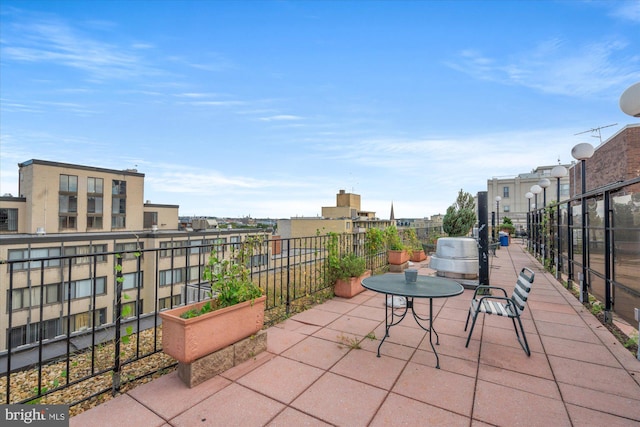 view of patio featuring a balcony