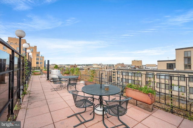 view of patio featuring a balcony