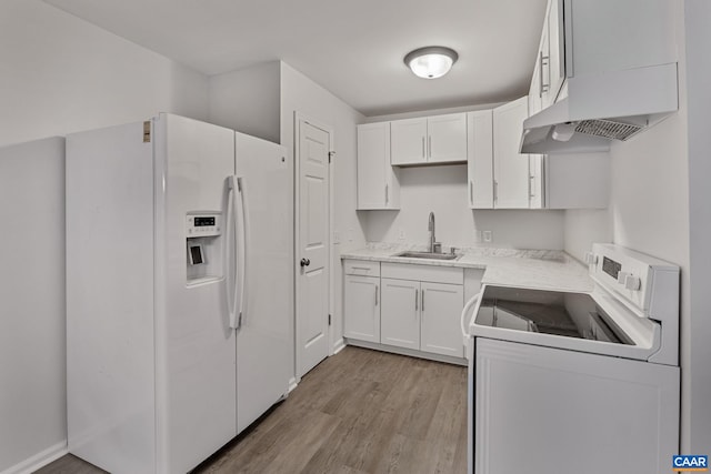 kitchen featuring light hardwood / wood-style floors, sink, white cabinets, white appliances, and extractor fan