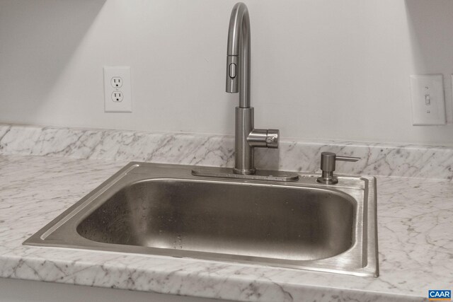 interior details with light stone counters and sink