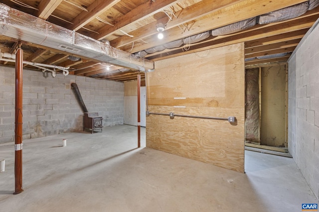 basement featuring a wood stove