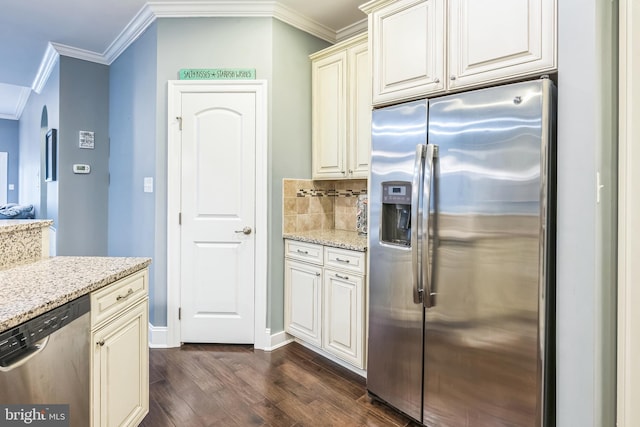 kitchen with light stone counters, appliances with stainless steel finishes, dark hardwood / wood-style floors, and ornamental molding