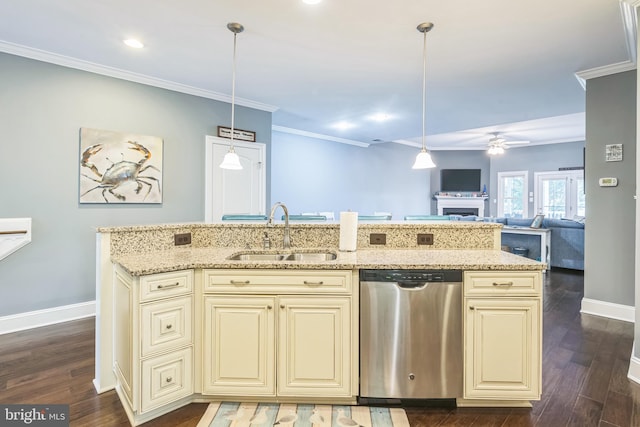 kitchen with dishwasher, hanging light fixtures, sink, and cream cabinetry