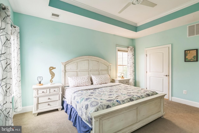 carpeted bedroom with crown molding and ceiling fan