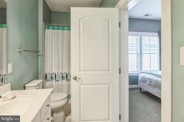 bathroom with vanity and toilet