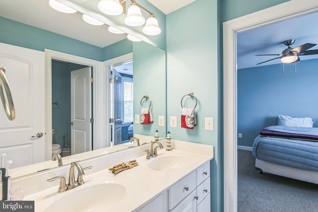 bathroom with ceiling fan, vanity, and toilet