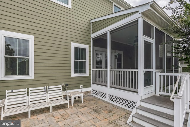 exterior space featuring a sunroom