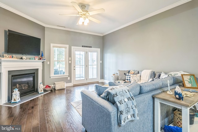 living room with ceiling fan, ornamental molding, and dark hardwood / wood-style flooring