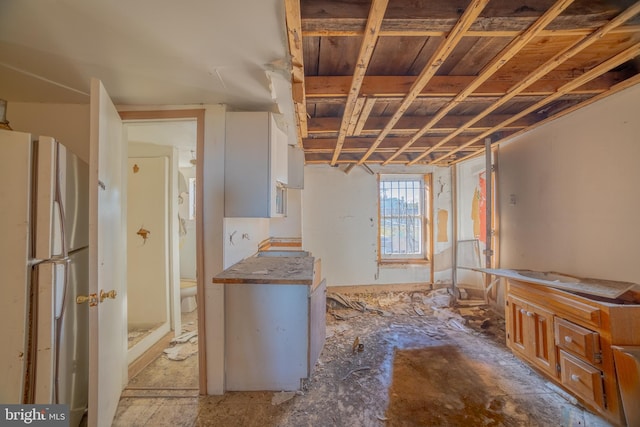 interior space featuring white refrigerator