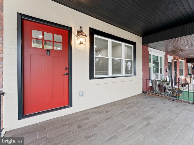 doorway to property with a porch