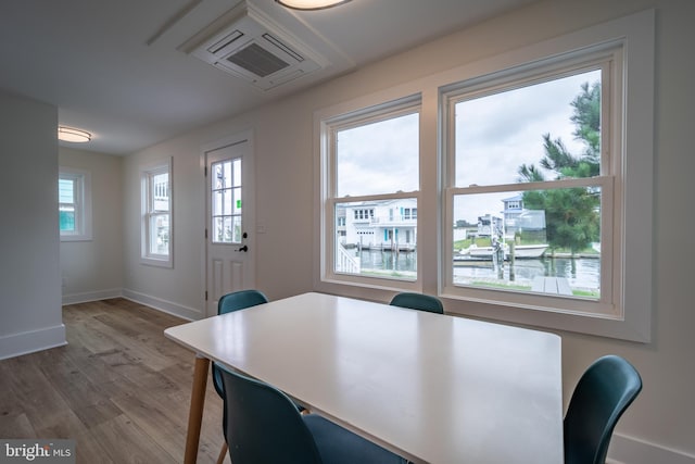 dining room featuring hardwood / wood-style floors and a wealth of natural light