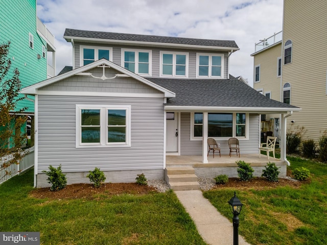 view of front of house featuring a porch and a front lawn