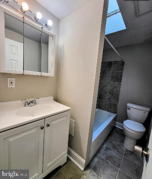 full bathroom featuring vanity, toilet, and washtub / shower combination