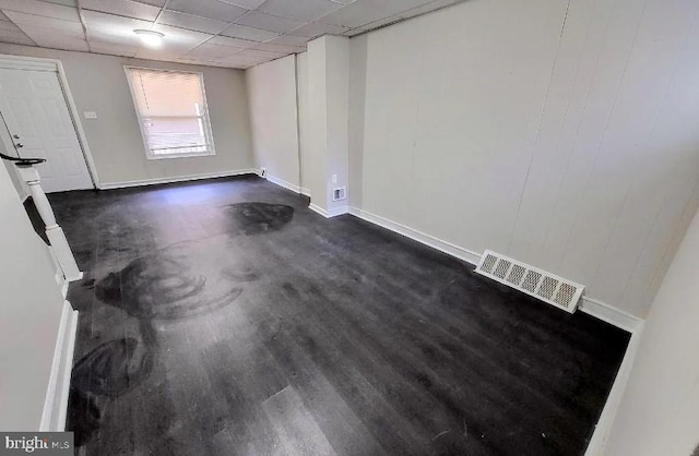 spare room featuring a drop ceiling