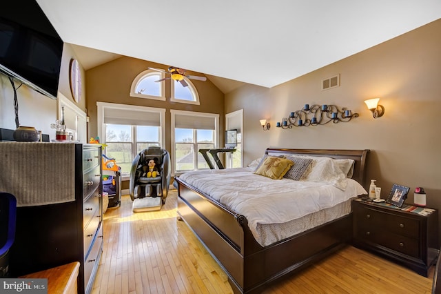 bedroom featuring vaulted ceiling, ceiling fan, and light hardwood / wood-style flooring