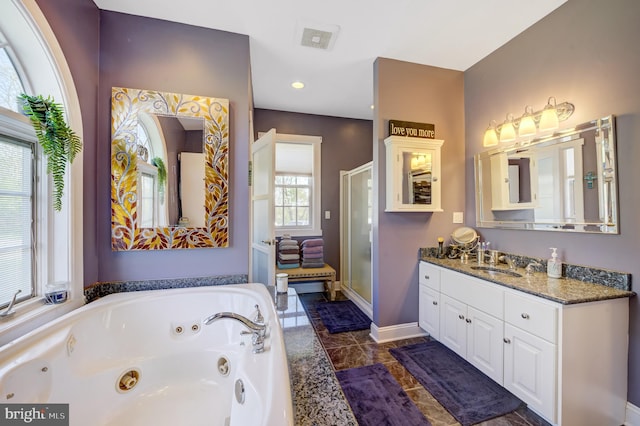 bathroom featuring shower with separate bathtub and vanity