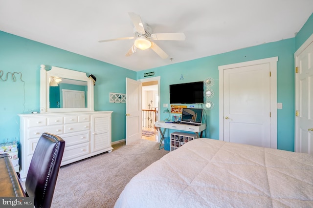 bedroom featuring ceiling fan and light carpet