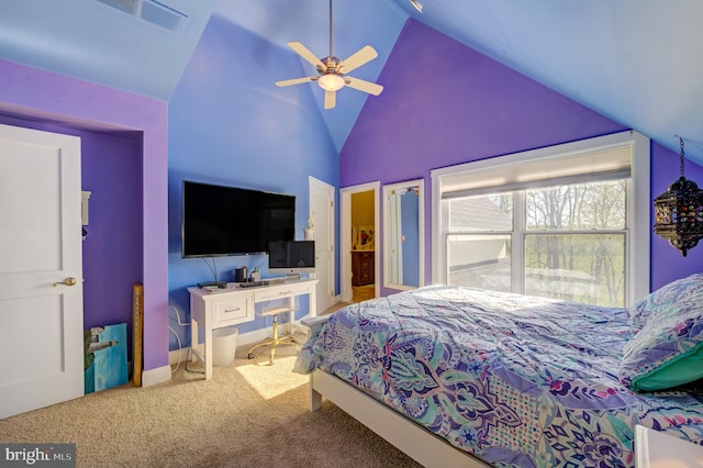 carpeted bedroom featuring high vaulted ceiling and ceiling fan