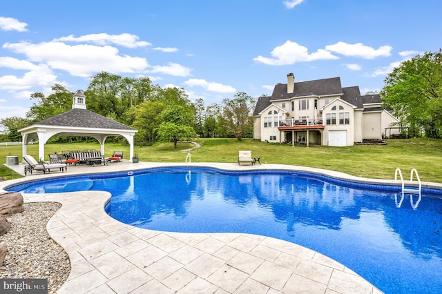 view of swimming pool with a patio, a gazebo, and a yard