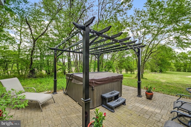 view of patio with a pergola and a hot tub