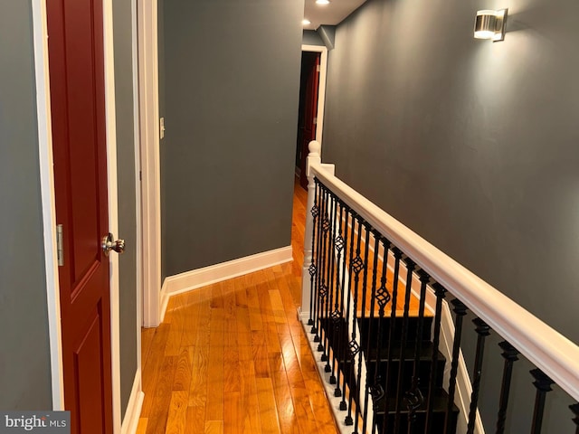 corridor with light hardwood / wood-style floors