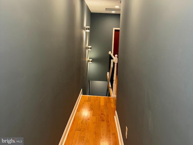 corridor featuring light hardwood / wood-style floors