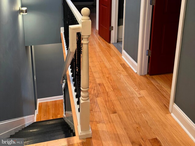 corridor featuring light hardwood / wood-style floors