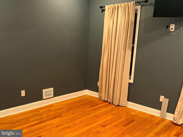 spare room featuring light hardwood / wood-style flooring