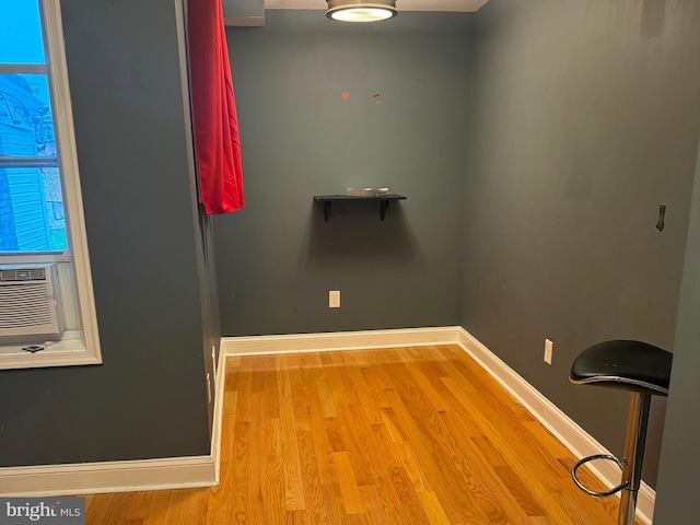 interior space featuring cooling unit and light hardwood / wood-style flooring