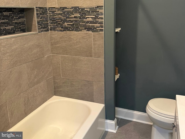 bathroom featuring toilet and a bathing tub