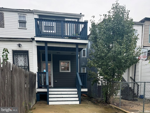 view of front facade with a balcony