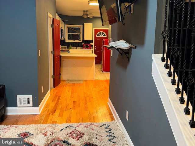 hallway featuring light hardwood / wood-style flooring