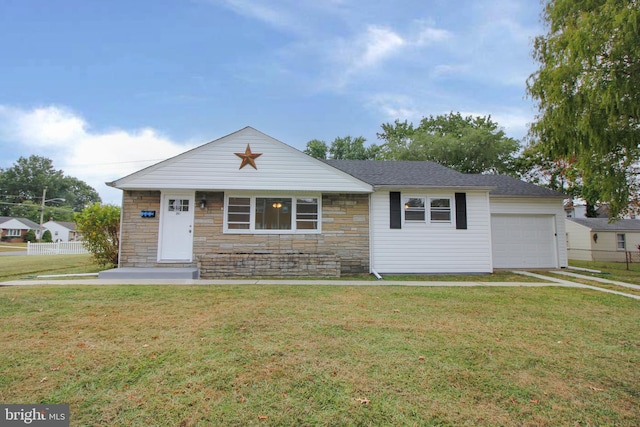 view of front of home with a garage and a front lawn