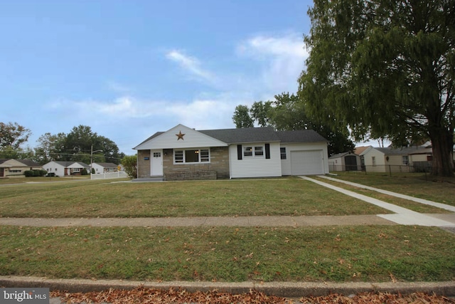 view of front of home featuring a front lawn and a garage