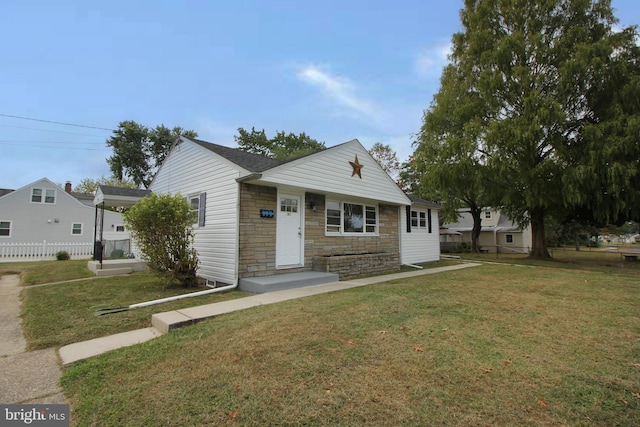 view of front of home with a front lawn