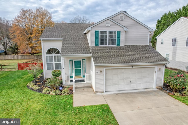 view of front property featuring a front yard and a garage