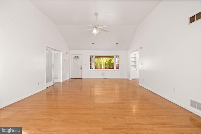 unfurnished living room featuring ceiling fan, light hardwood / wood-style floors, and high vaulted ceiling