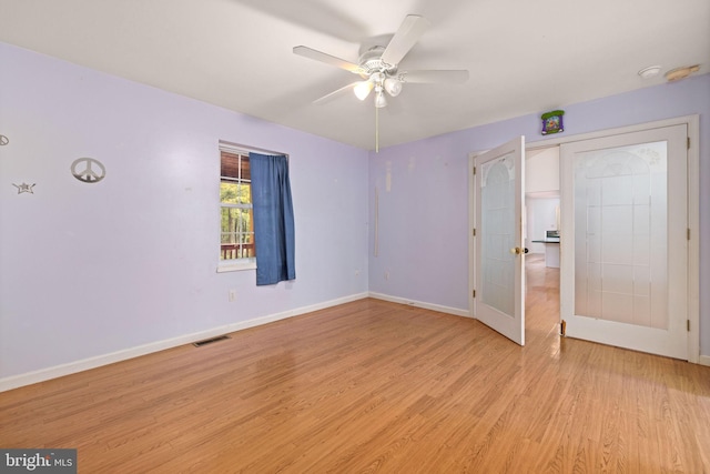 unfurnished bedroom featuring ceiling fan and light hardwood / wood-style floors