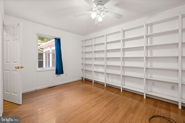 storage room featuring ceiling fan