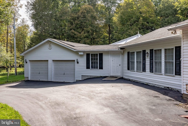 single story home featuring a garage