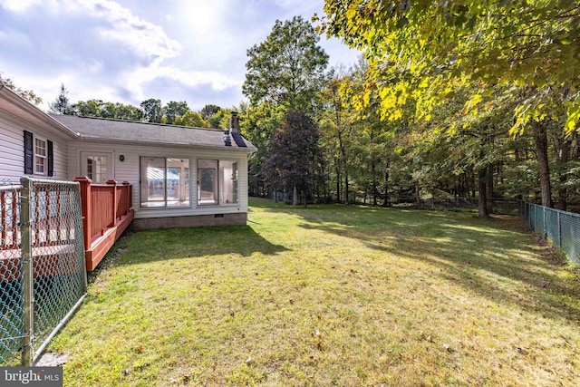 view of yard with a deck