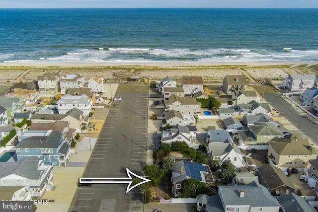 aerial view with a beach view and a water view