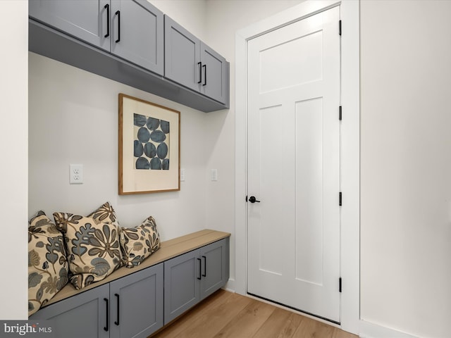 mudroom with light hardwood / wood-style flooring