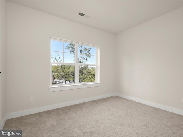 unfurnished room with carpet flooring