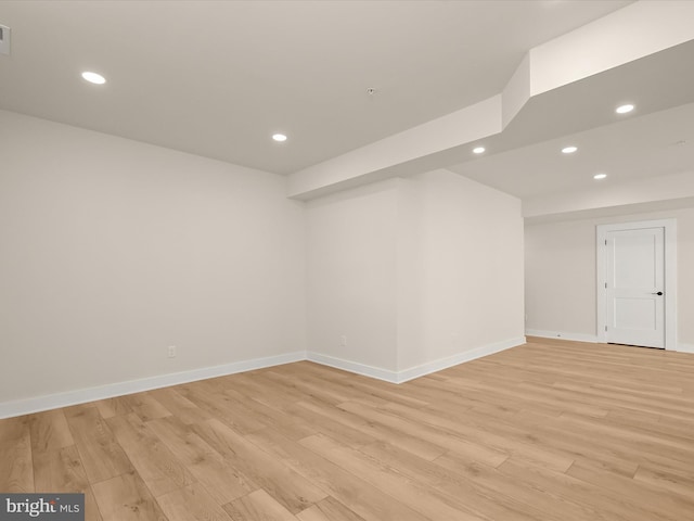 spare room with light wood-type flooring