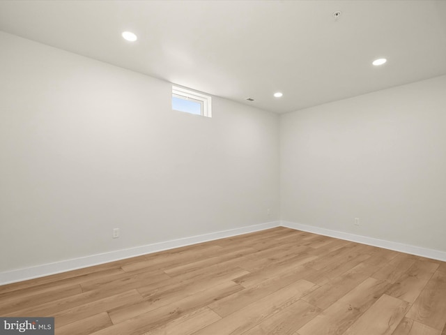 spare room featuring light wood-type flooring