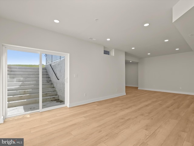 spare room featuring light hardwood / wood-style flooring