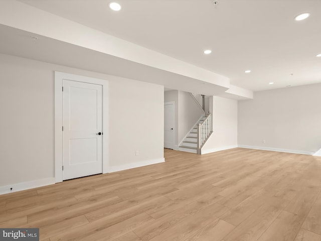 basement featuring light hardwood / wood-style flooring