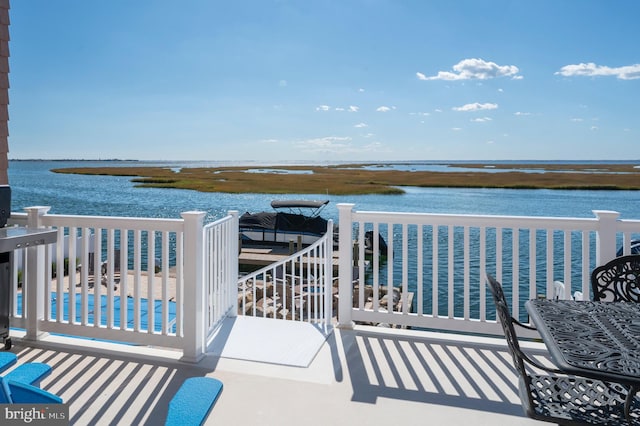 balcony featuring a water view