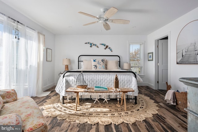 bedroom with ceiling fan and dark hardwood / wood-style flooring